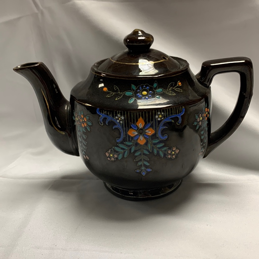 Japanese tea pot with hand painted design.